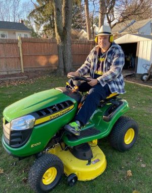 Steven on a riding lawn mower